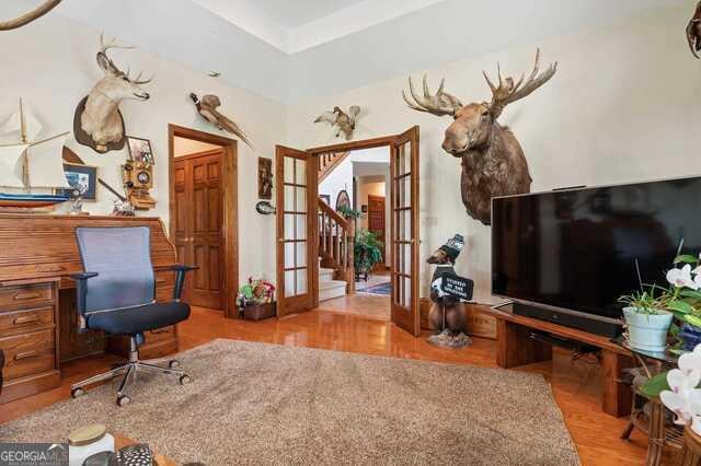3917 Harris Neck Rd NE, Townsend, GA 31331 - office area featuring french doors and wood finished floors