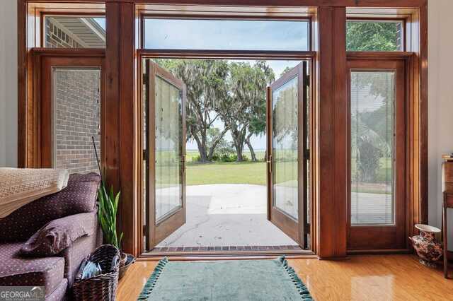 doorway to outside with light hardwood / wood-style flooring