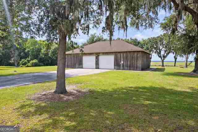 garage featuring a yard