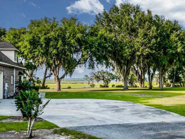 view of property's community with a lawn