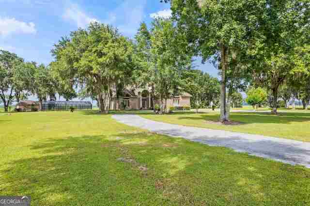 view of property's community featuring a yard