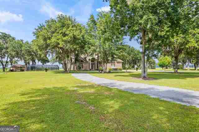 3917 Harris Neck Rd NE, Townsend, GA 31331 - view of community featuring a lawn