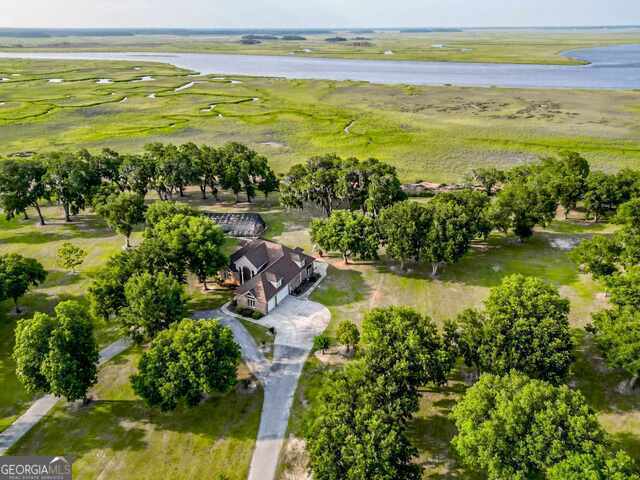 drone / aerial view featuring a rural view and a water view