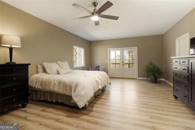 bedroom featuring access to exterior, a ceiling fan, french doors, light wood-type flooring, and baseboards