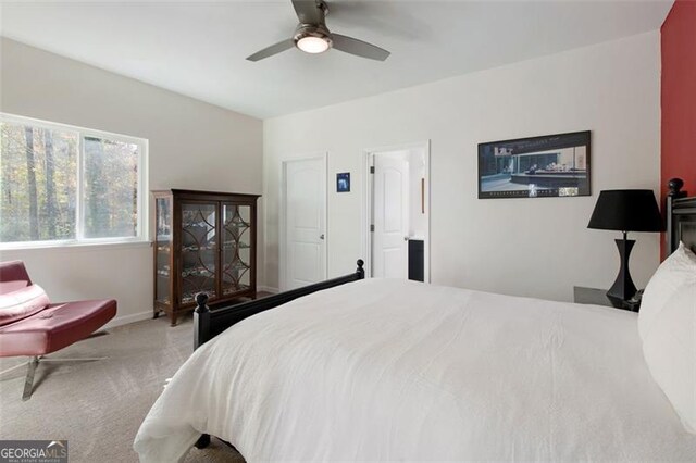bedroom with carpet flooring, baseboards, and a ceiling fan