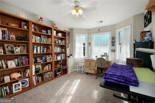 bedroom featuring visible vents and a textured ceiling