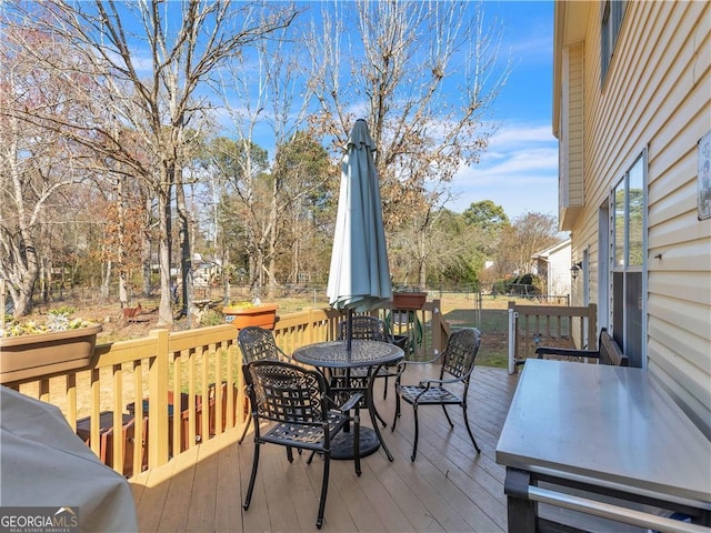 deck featuring outdoor dining area