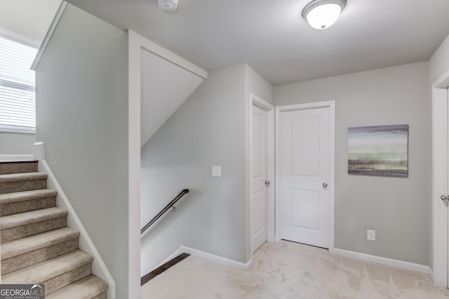 stairs with carpet flooring and vaulted ceiling