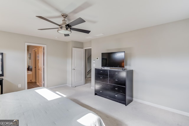 carpeted bedroom with ceiling fan and connected bathroom