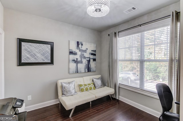 office space with a chandelier, dark hardwood / wood-style floors, and plenty of natural light