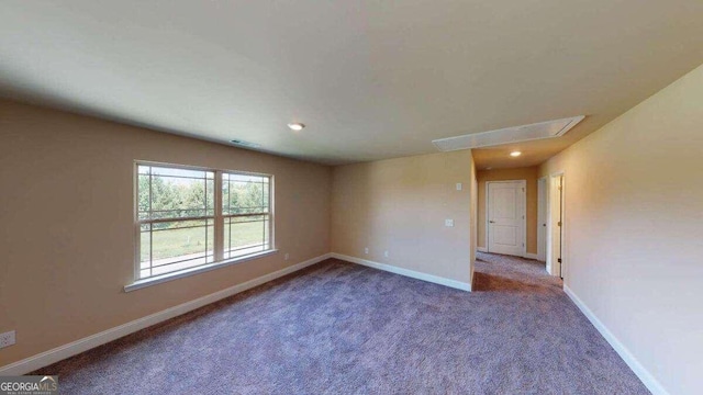 spare room featuring carpet floors