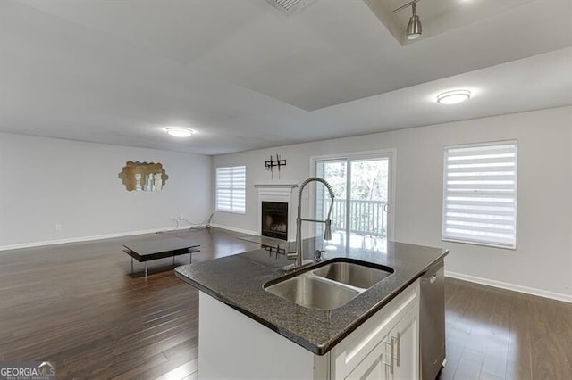 kitchen featuring dishwasher, white cabinetry, sink, and dark wood-type flooring