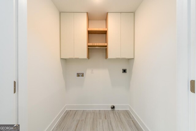 laundry room featuring electric dryer hookup, cabinets, and hookup for a washing machine