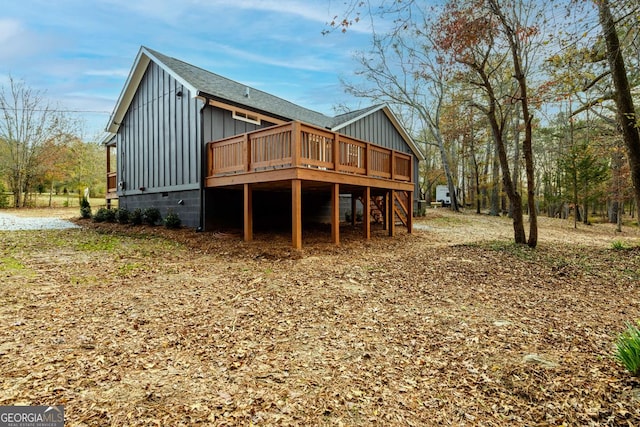 back of property with a wooden deck