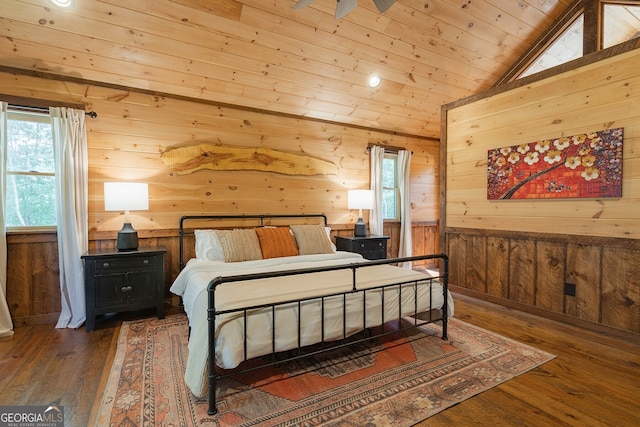 bedroom with lofted ceiling, wooden walls, wooden ceiling, and dark hardwood / wood-style floors