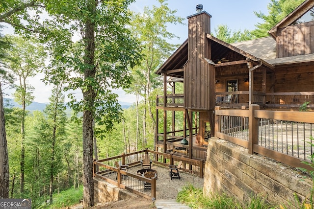 exterior space with a fire pit and a mountain view