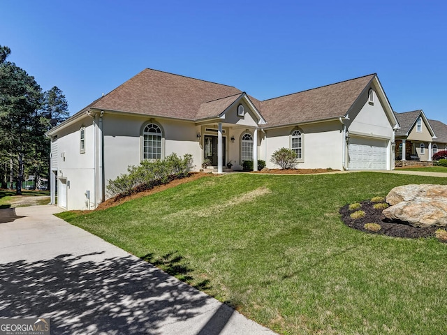 ranch-style house with a front lawn and a garage