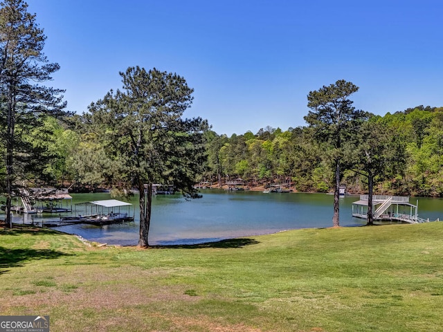 view of water feature with a dock