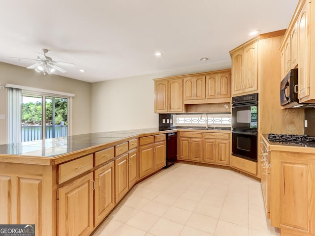 kitchen featuring black appliances, ceiling fan, kitchen peninsula, and sink