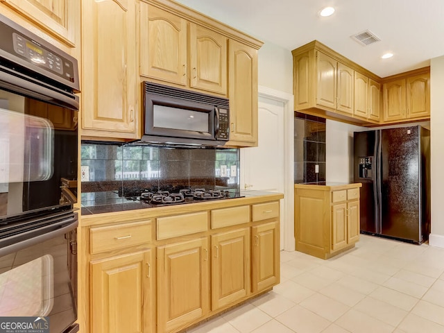 kitchen featuring backsplash, light brown cabinets, light tile patterned floors, and black appliances