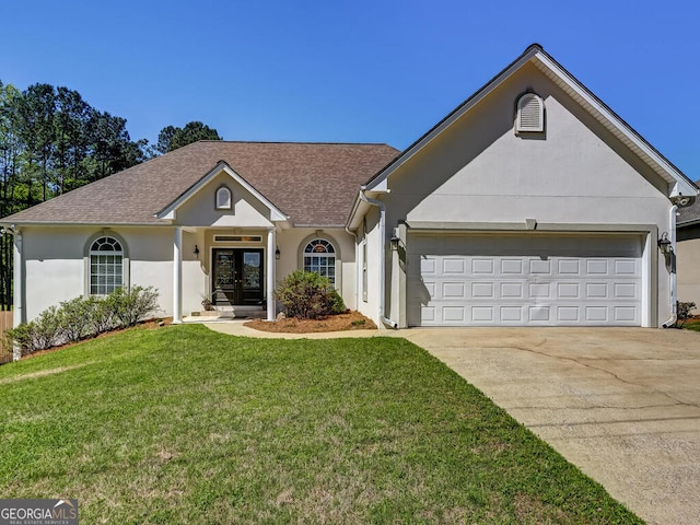 ranch-style house featuring french doors, a garage, and a front lawn