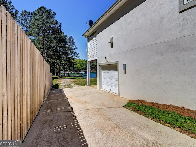 view of side of home with a garage