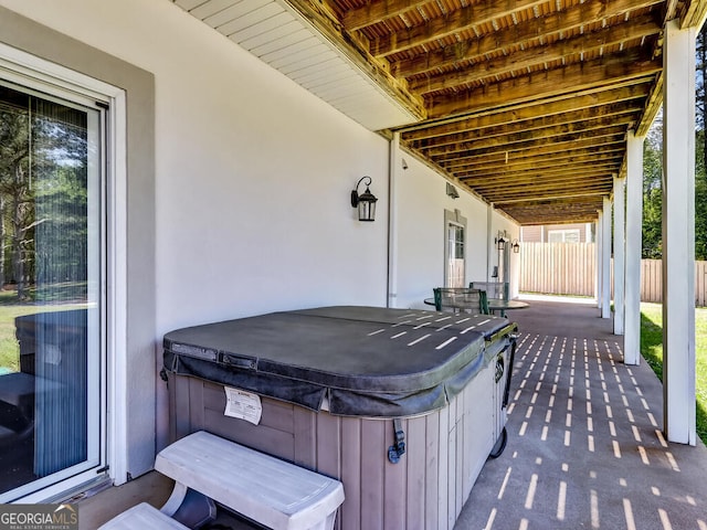 view of patio / terrace featuring a hot tub