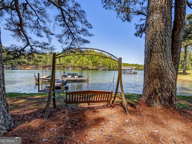 view of dock with a water view