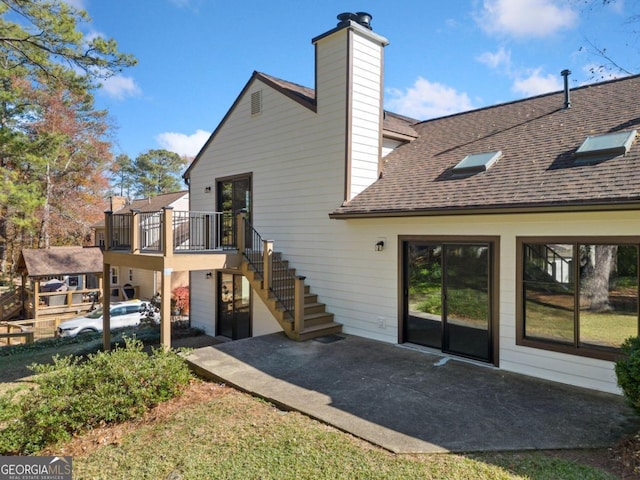 rear view of house featuring a patio area