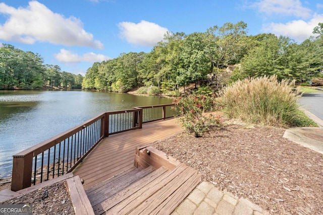 view of dock featuring a deck with water view