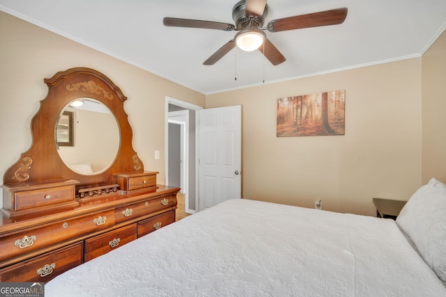 bedroom featuring ceiling fan and ornamental molding