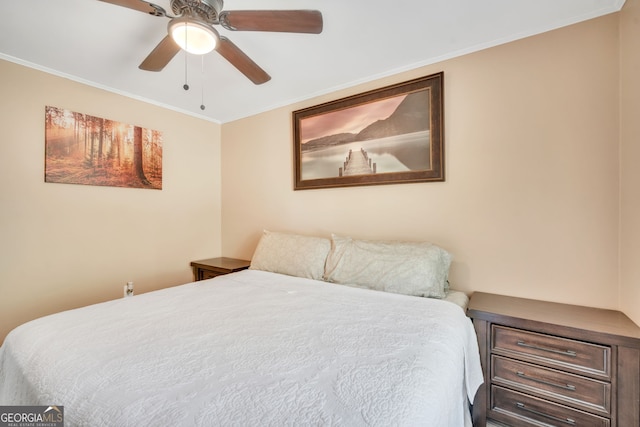 bedroom with ceiling fan and ornamental molding