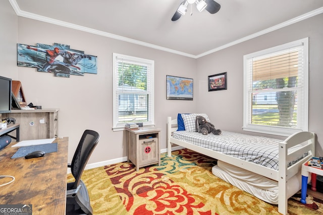 carpeted bedroom featuring ceiling fan and ornamental molding