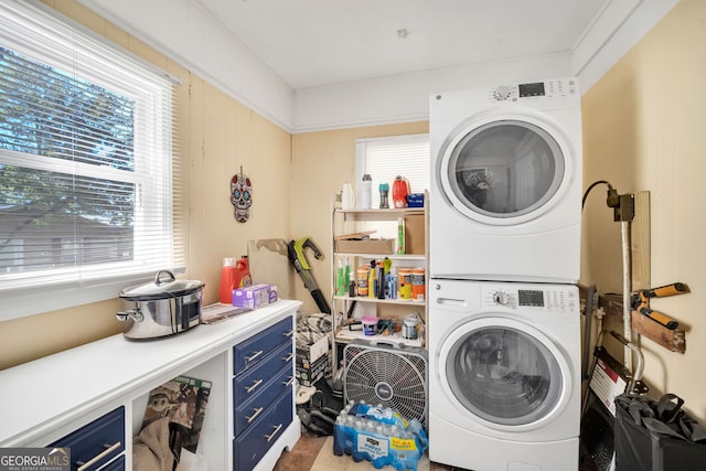 laundry area with stacked washer / drying machine