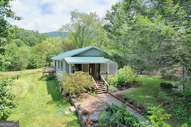 view of front facade with covered porch and a front yard