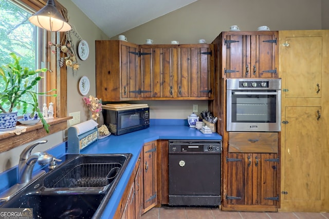 kitchen with plenty of natural light, black appliances, lofted ceiling, and sink