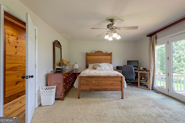 carpeted bedroom with ceiling fan and access to exterior