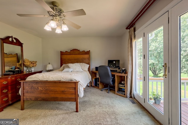 bedroom with access to exterior, light carpet, and ceiling fan