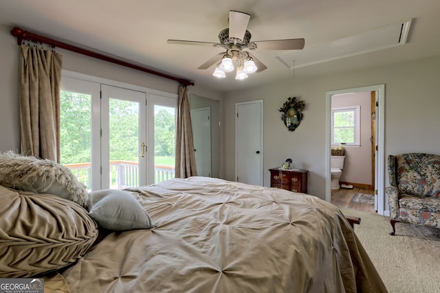 bedroom with access to outside, connected bathroom, ceiling fan, and hardwood / wood-style floors