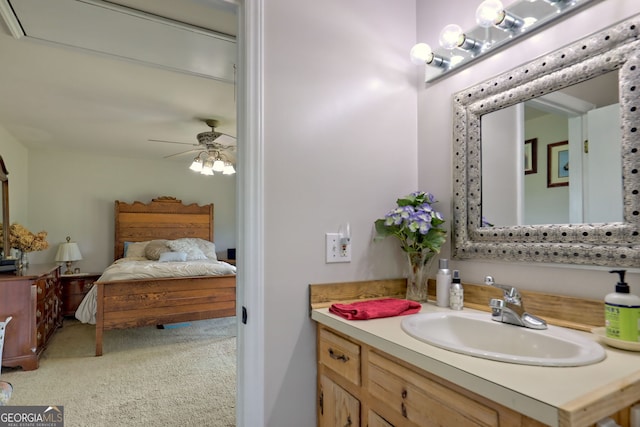 bathroom featuring ceiling fan and vanity