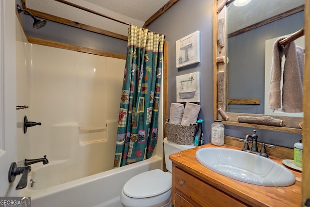 full bathroom featuring vanity, toilet, shower / bathtub combination with curtain, and a textured ceiling