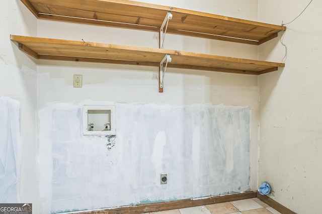 clothes washing area with hookup for a washing machine and hookup for an electric dryer