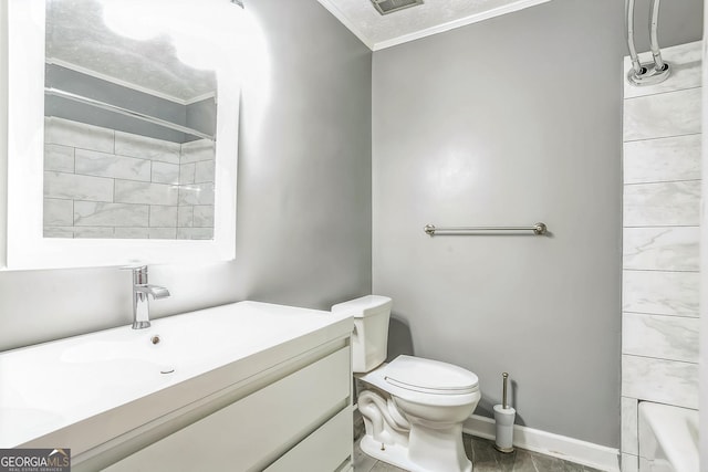 bathroom featuring vanity, toilet, and ornamental molding