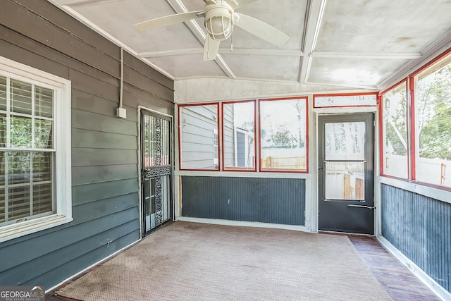 unfurnished sunroom with vaulted ceiling and ceiling fan