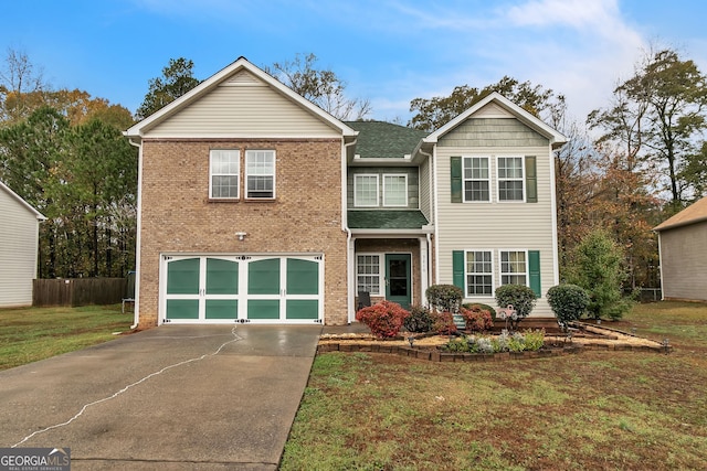 view of front property with a front yard and a garage