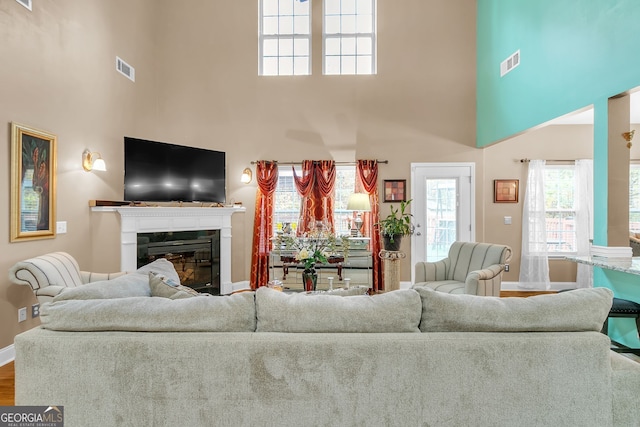 living room with a high ceiling