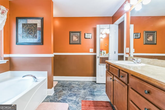 bathroom featuring a bathing tub and vanity