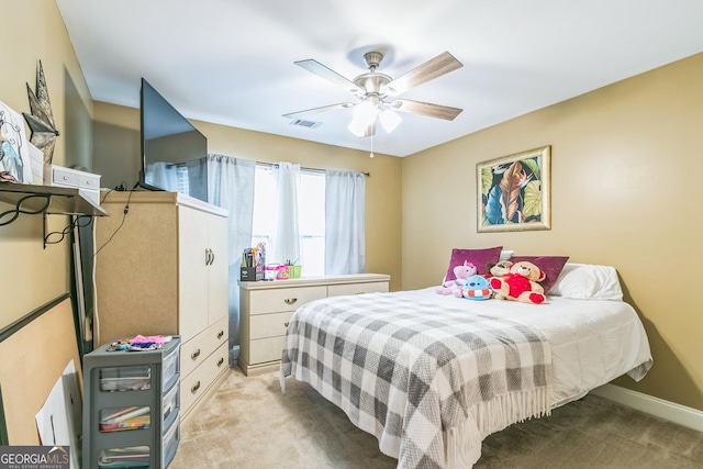 carpeted bedroom with ceiling fan