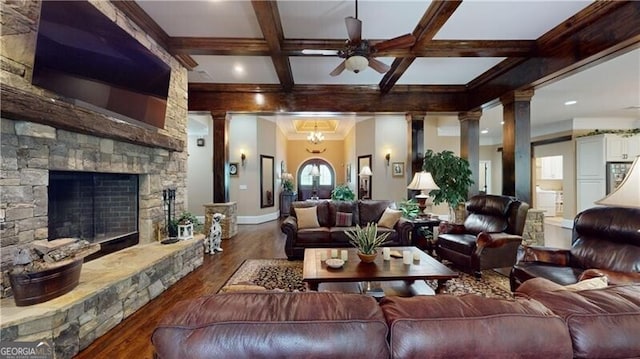 living room featuring a fireplace, dark hardwood / wood-style flooring, beamed ceiling, and coffered ceiling