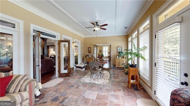 sunroom featuring french doors and ceiling fan